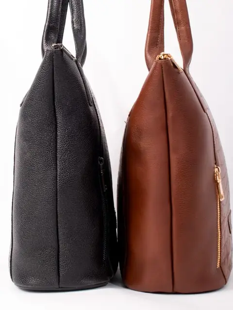 Black and cognac leather totes side by side