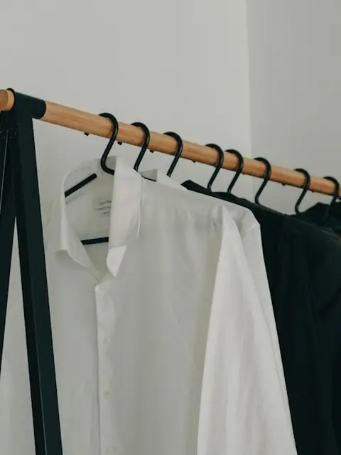 Crisp white button-up on a black hanger